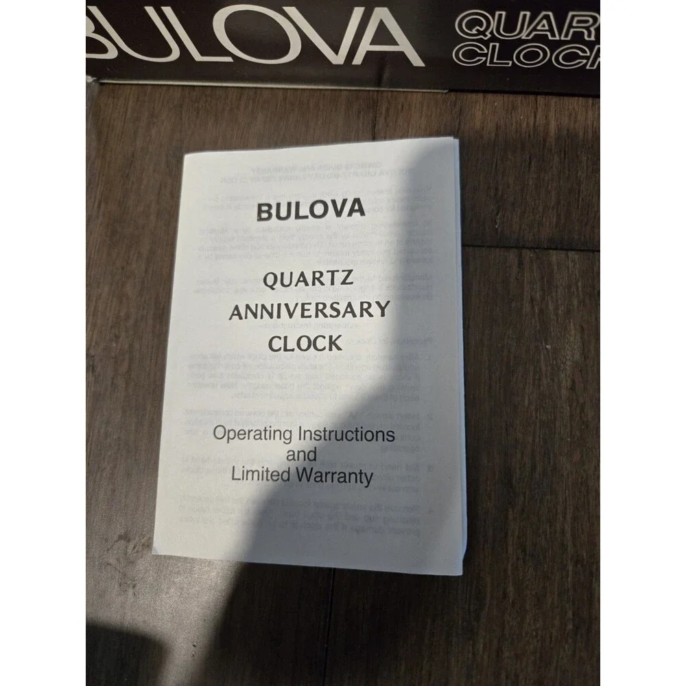 Bulova Tristan I B8818 Anniversary Clock - Glass Dome, Rotating Crystal Pendulum